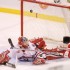 Boston University's Jason Lawrence (21), in action, scores game-winning goal vs Northeastern University goalie Brad Thiessen (39). Kristyn Ulanday/The Daily Free Press for Blast Magazine Boston University's Jason Lawrence (21), in action, scores game-winning goal vs Northeastern University goalie Brad Thiessen (39). Kristyn Ulanday/The Daily Free Press for Blast Magazine