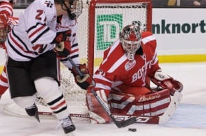 Kieran Millan (BU) makes a save against Alex Tuckerman (NEU). Peter Keeling for Blast Magazine