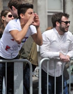 Boston University Junior Chirstian Ronaldo cheers on runners on Beacon Street. (Blast Magazine staff photo/Sarah Gordon)