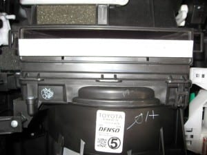 Slide the new filter in, replace the cover, replace the glove box and screw, and you're done!