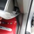 Open the glove box. There's one black screw and some tabs holding it on. Remove the screw with a phillips screwdriver, and it comes off easy. Open the glove box. There's one black screw and some tabs holding it on. Remove the screw with a phillips screwdriver, and it comes off easy.