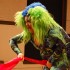 Becca D'Bus, during her drag interpretation of the famous performance art piece "Interior Scroll", extracts a 30-yard banner of fabric from her spandex vagina and passes it through the crowd of 60. (Blast Staff photo/Adam J. Sell)