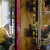 Tan's collection of drag paraphernalia includes several gaudy necklaces, attached to the shelving in his sewing room with rock climbing carabeeners. (Blast Staff photo/Adam J. Sell)