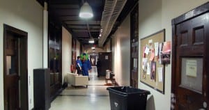 Becca D'Bus, Eugene Tan's drag character, waits outside the performance hall before his song at a performance art recital March 20. (Blast Staff photo/Adam J. Sell)