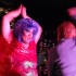 Becca D'Bus, while performing "Total Eclipse of the Heart" at Jacque's Cabaret in the South End, interacts with a patron who chose to get up on stage with her. (Blast Staff photo/Adam J. Sell)