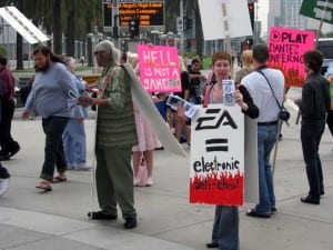 Protesters demonstrate against Dante's Inferno, a fighting game under development by Electronic Arts. (Blast Magazine staff photo/John M. Guilfoil)