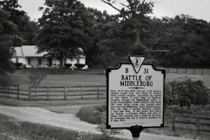 One of the many placards alerting of a battle along a drive