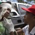 Another Red Cross volunteer tending to a child Another Red Cross volunteer tending to a child