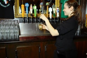 You DO tilt the glass when you pour. (Blast staff photo/Steve Osemwenkhae)