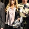 Dina Lohan leaves the Beverly Hills Courthouse carrying a plastic bag containing Lindsay's shoes on September 24 in Beverly Hills (WireImage)