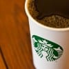 A cup of coffee with the new Starbucks logo