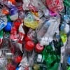 There is no documented proof that recycled PET plastic carpet fibers are dangerous if ingested in small amounts, but it is advisable to stay safe by keeping them out of our mouths and noses by vacuuming often. Pictured: PET bottles headed for recycling. (Media credit/Twicepix via Flickr)