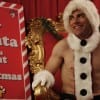 Schmidt (Max Greenfield) "dressed" as Sexy Santa for his office party.