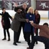 The gang shuffling their candidate across the ice not-so gracefully.