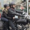 Emma (Jennifer Morrison) hops on the stranger's (Elon Bailey) bike, taking a leap of faith.