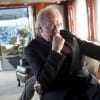 The nefarious and mysterious Michael (Michael Gambon) unnerves adversaries as he downs a morning scotch.