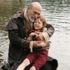 Geppetto (Tony Amendola) cradles his son, Pinocchio, after he's transformed from a puppet into a real boy.