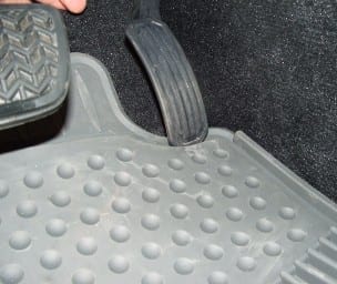 An example of accelerator pedal interference caused by out-of-position all-weather floor mat. (Media credit/Courtesy of NHTSA)