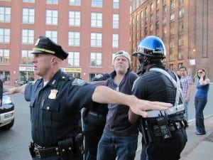 A protester is arrested during the bridge rally (Blast Staff photo/John Stephen Dwyer)