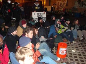 Defiantly seated in the same area that Occupy Boston held its General Assemblies, these activists mic checked various messages before being arrested. (Blast Staff photo/John Stephen Dwyer) 