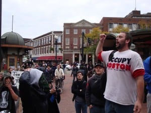 John Murphy (right) speaks to crowds in Harvard Square during an October rally.  (Blast Staff photo/John Stephen Dwyer)