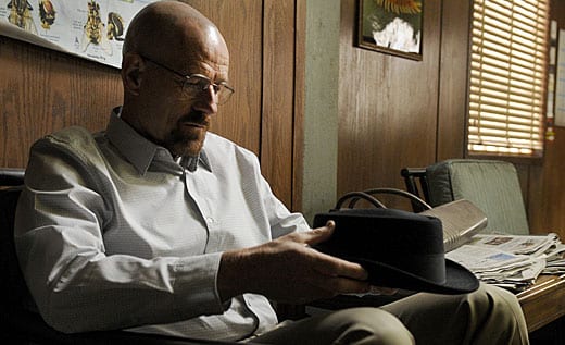 Walter White (the glorious Bryan Cranston) pulls at the symbolic loose thread of his Heisenberg hat